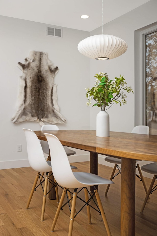 dining room with hardwood / wood-style floors