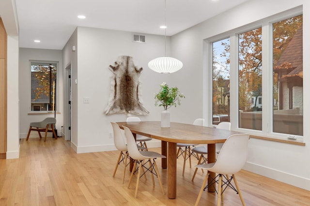 dining area with light hardwood / wood-style floors