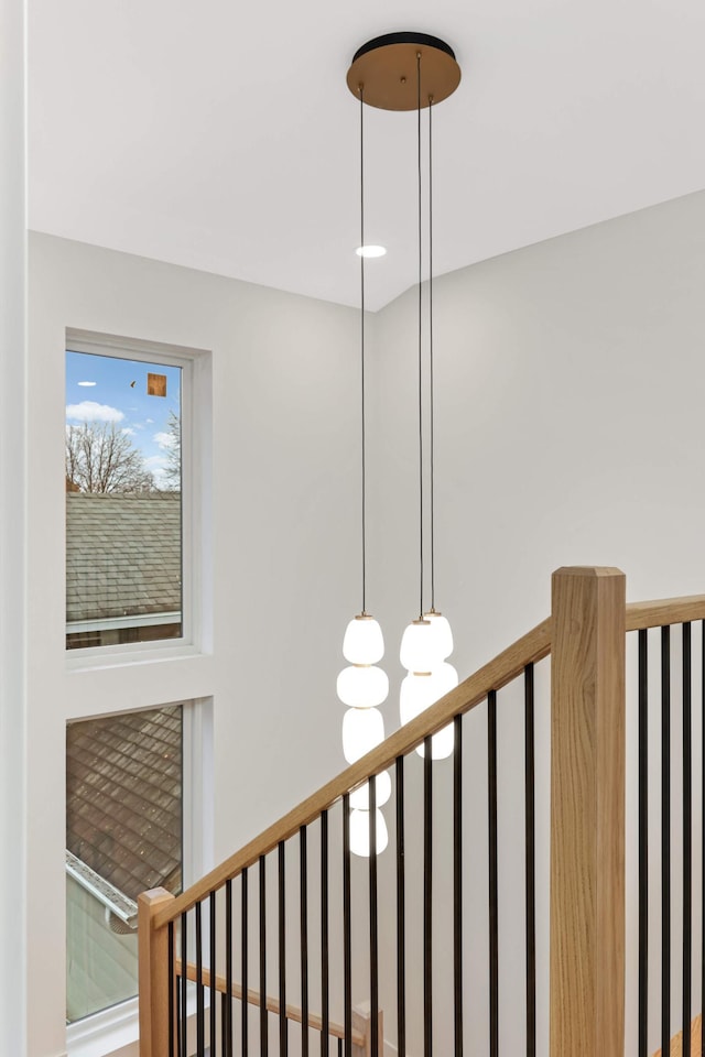 stairs featuring an inviting chandelier