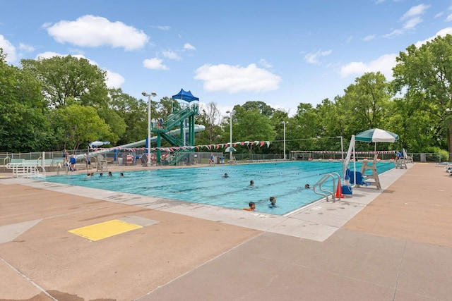 view of swimming pool with a patio area