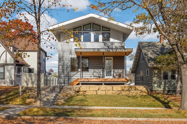 modern home with a front lawn