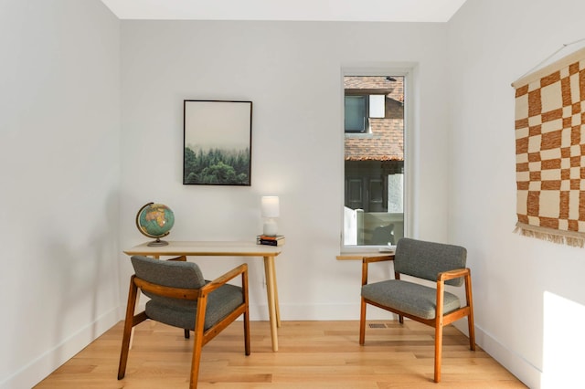 sitting room featuring light hardwood / wood-style floors