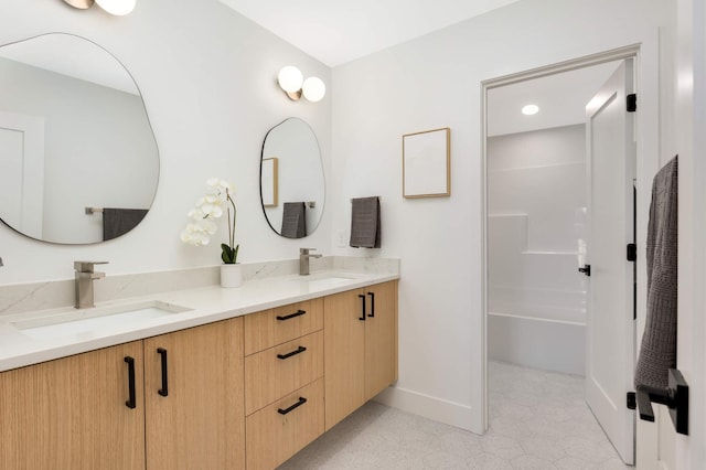 bathroom with vanity and walk in shower