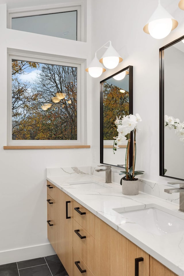 bathroom with tile patterned floors and vanity