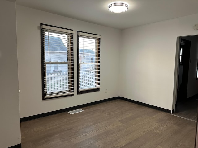 unfurnished room featuring wood-type flooring