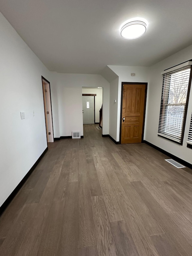 unfurnished room with light wood-type flooring