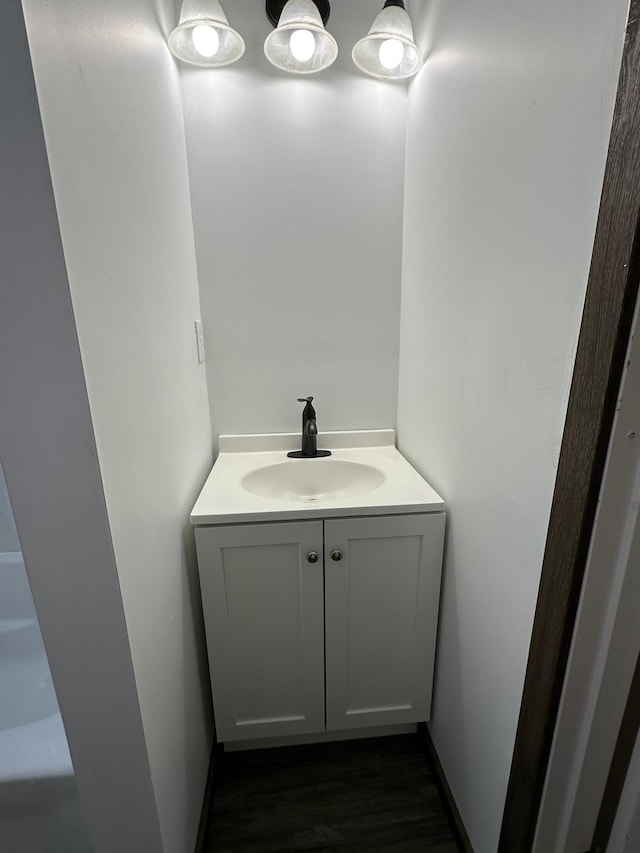 bathroom featuring vanity and hardwood / wood-style floors