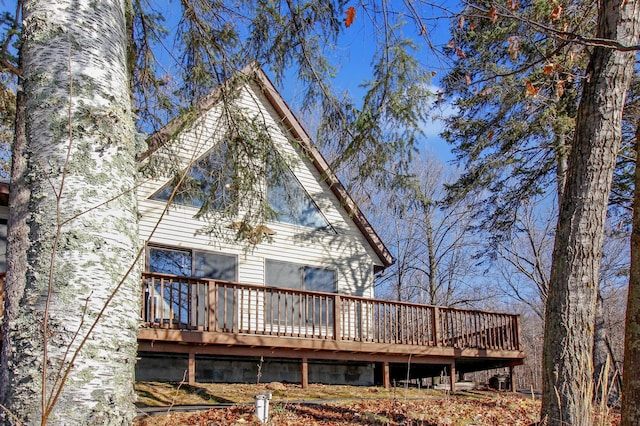 rear view of property with a deck