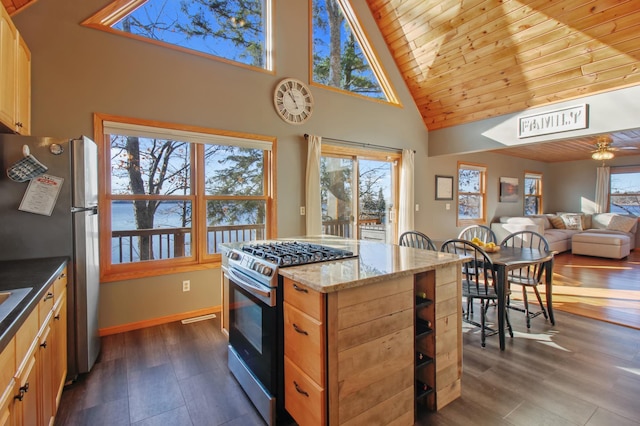 kitchen featuring wood ceiling, light stone counters, appliances with stainless steel finishes, dark wood-style floors, and high vaulted ceiling