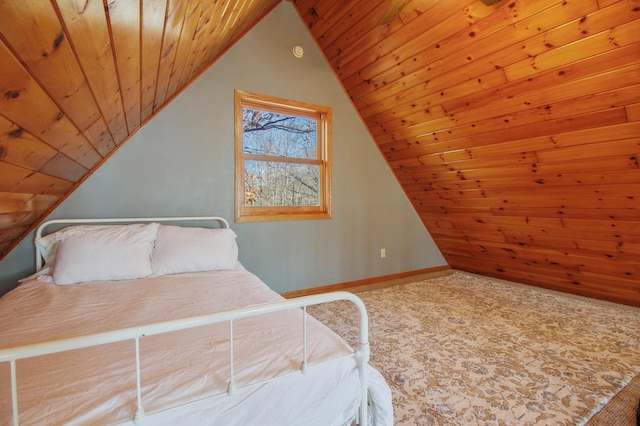 carpeted bedroom featuring wooden ceiling, baseboards, and lofted ceiling