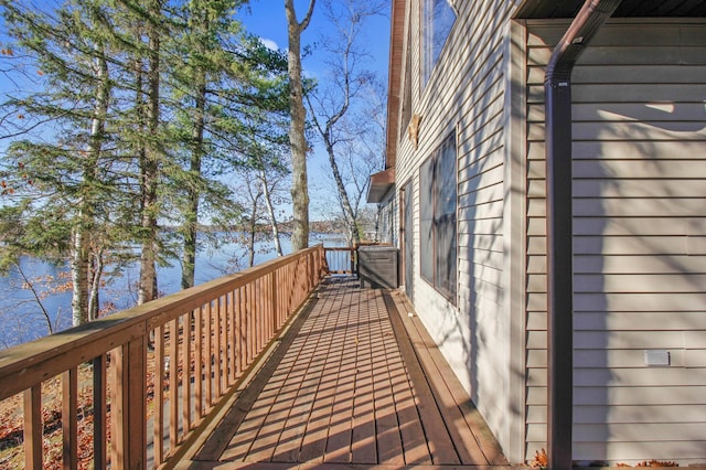 wooden terrace with a water view