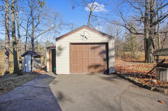 detached garage with aphalt driveway