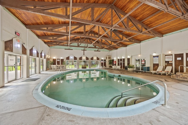 view of pool with a hot tub