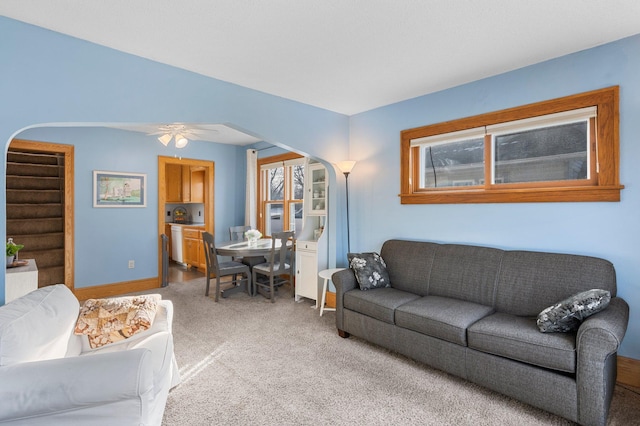 living room with ceiling fan and carpet flooring