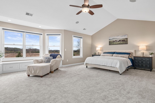 bedroom with ceiling fan, light carpet, and vaulted ceiling