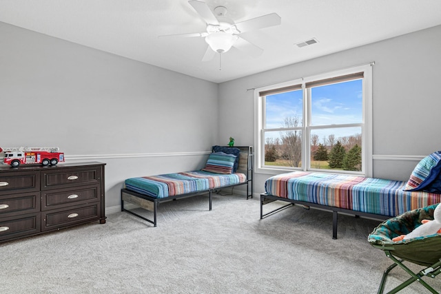 bedroom with light carpet and ceiling fan