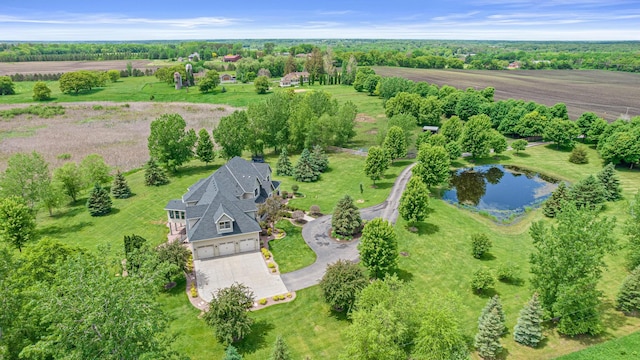 birds eye view of property with a rural view and a water view