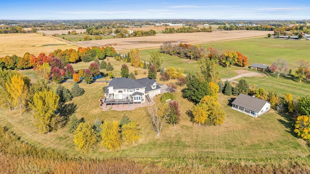 birds eye view of property with a rural view