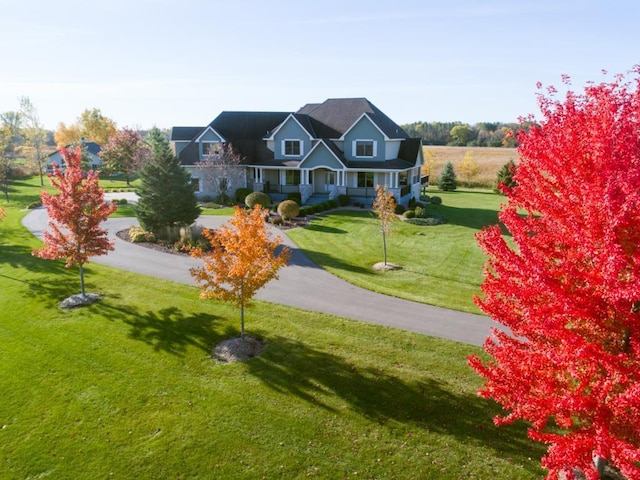 view of front of home featuring a front lawn and a porch