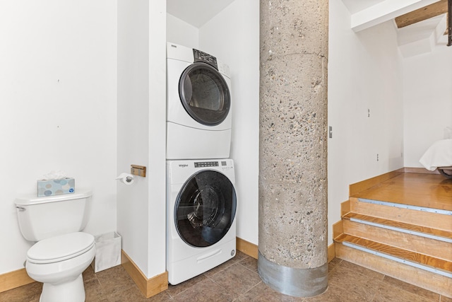 laundry area with stacked washer and dryer