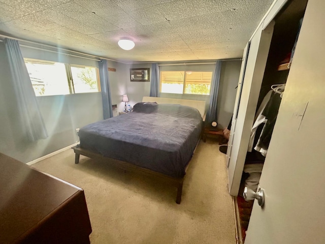 bedroom featuring multiple windows, carpet, and billiards