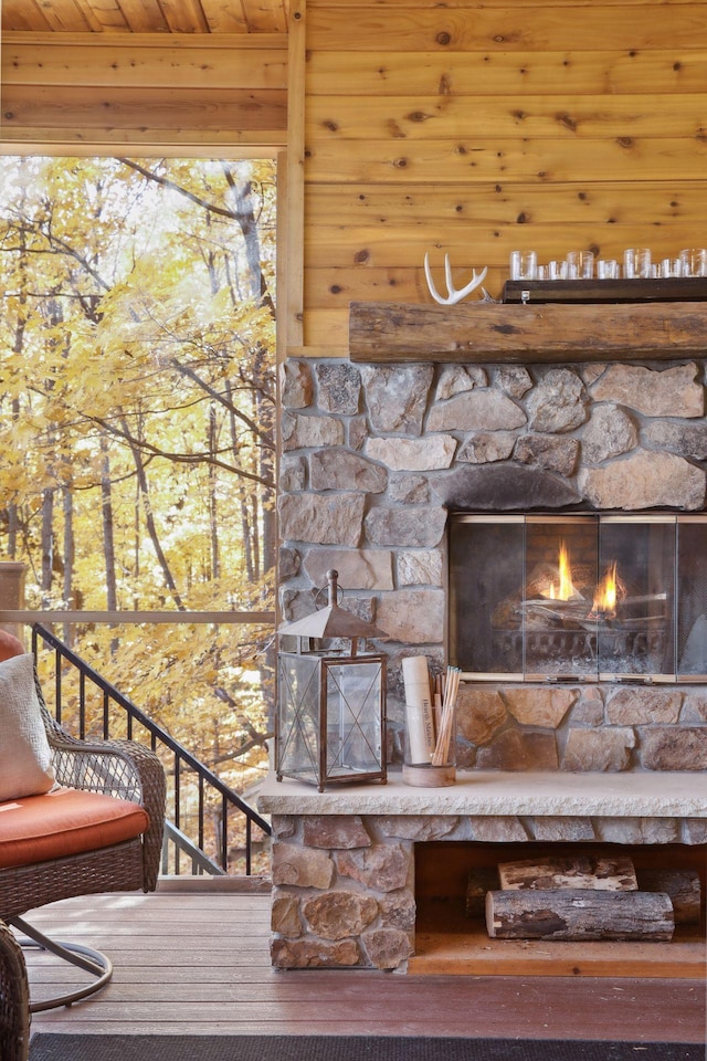 exterior details with wooden ceiling and an outdoor stone fireplace