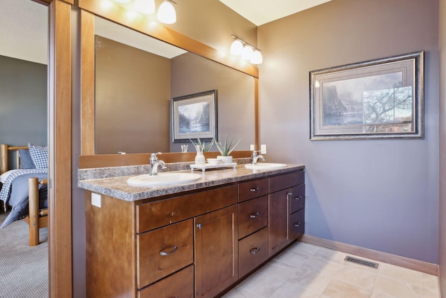 bathroom with vanity and tile patterned floors