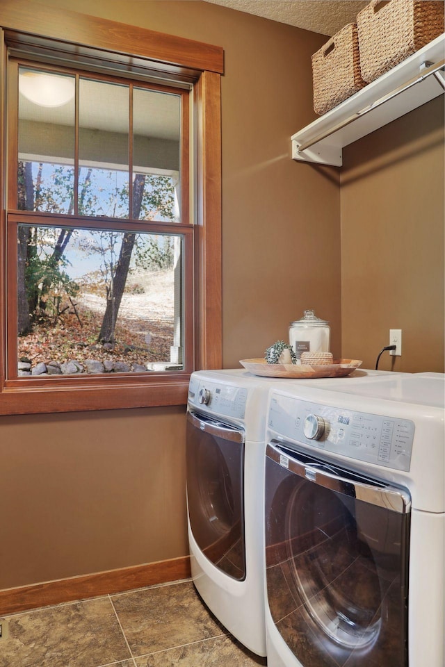 washroom featuring washer and clothes dryer