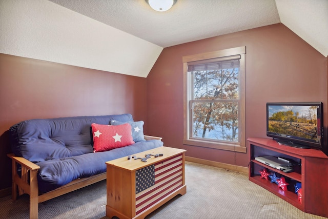 living room with a textured ceiling, light carpet, and lofted ceiling