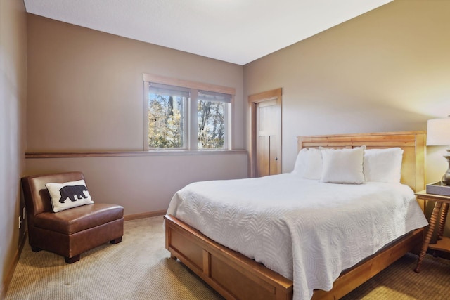 bedroom featuring light carpet