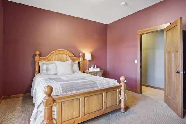 carpeted bedroom with a textured ceiling