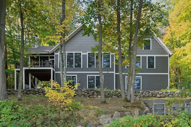 back of property featuring a deck