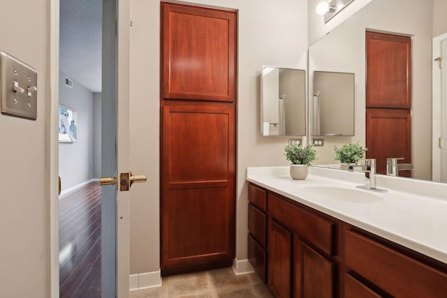 bathroom featuring hardwood / wood-style flooring and vanity