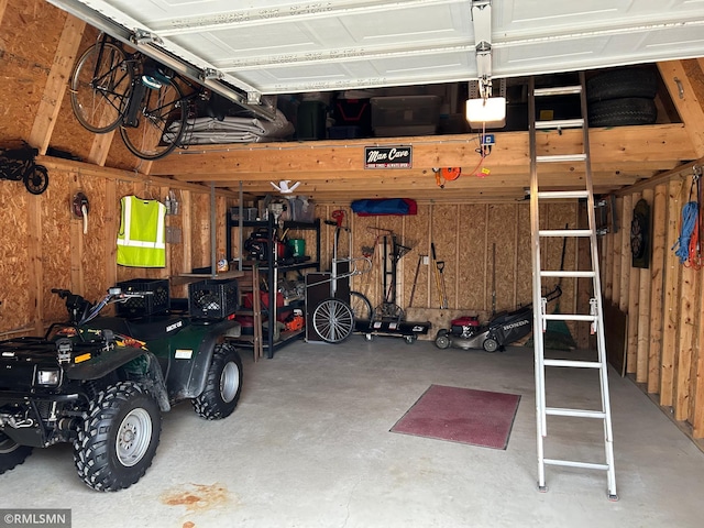 garage with wood walls