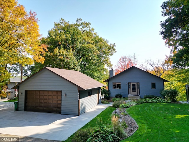 8834 Bishop Ave NW, Maple Lake, MN 55358 - view of front of property featuring a garage, a chimney, a front lawn, and an outbuilding