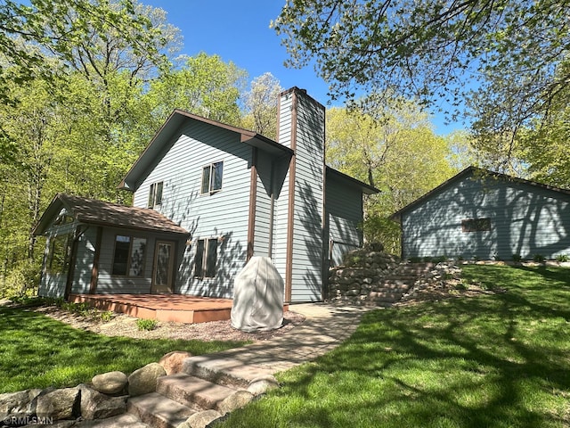 8834 Bishop Ave NW, Maple Lake, MN 55358 - rear view of property with a chimney and a yard