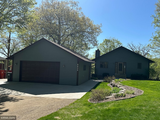 8834 Bishop Ave NW, Maple Lake, MN 55358 - view of front of property with a garage, a front lawn, a chimney, and an outdoor structure
