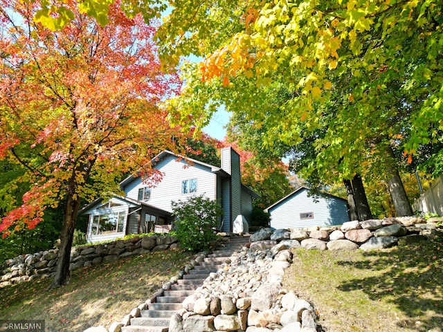 8834 Bishop Ave NW, Maple Lake, MN 55358 - view of property exterior featuring stairway and a chimney