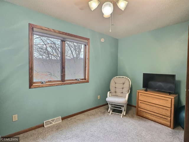 8834 Bishop Ave NW, Maple Lake, MN 55358 - sitting room with baseboards, carpet flooring, ceiling fan, and a textured ceiling
