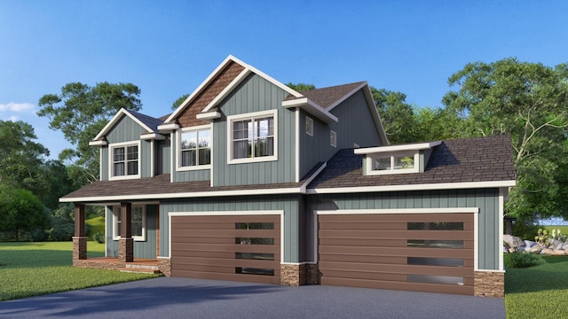 craftsman-style home featuring roof with shingles, aphalt driveway, a front lawn, and board and batten siding