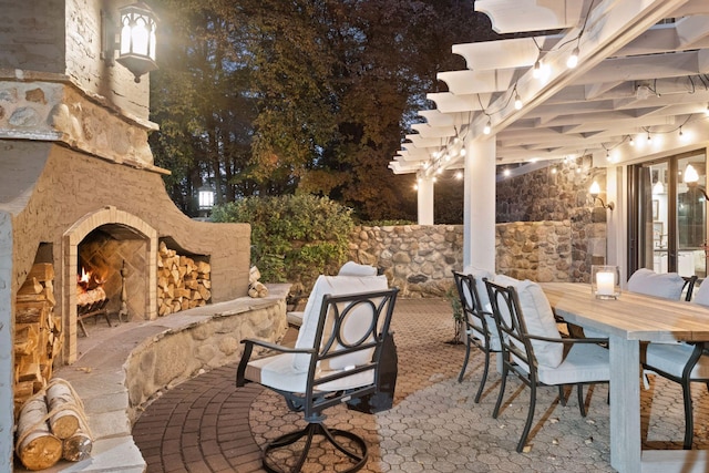 view of patio / terrace featuring an outdoor stone fireplace