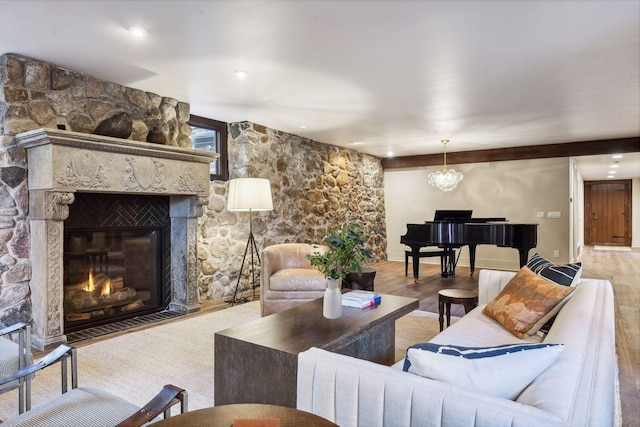 living room featuring wood-type flooring and a fireplace