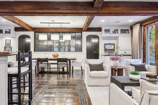 living room with beamed ceiling