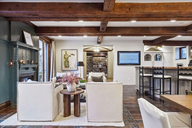 living room featuring beamed ceiling