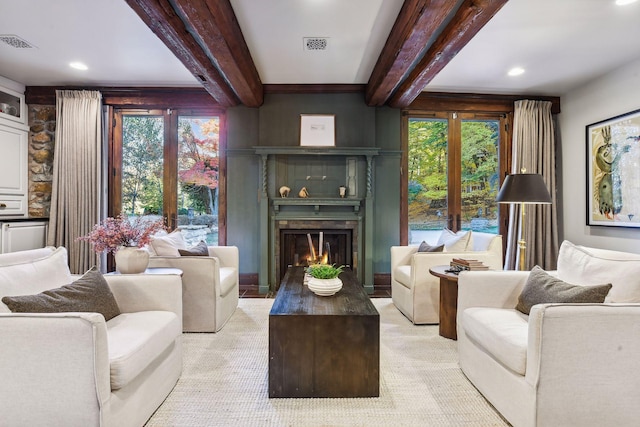 living room featuring beamed ceiling