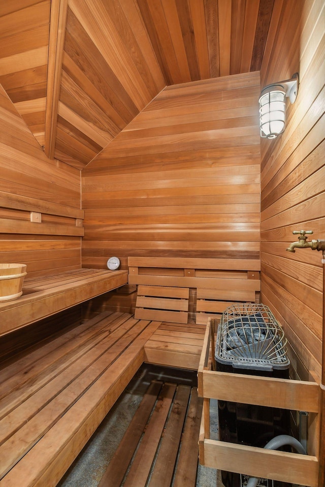 view of sauna / steam room with wooden walls and wooden ceiling