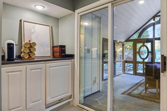 interior space with lofted ceiling, french doors, and wooden ceiling