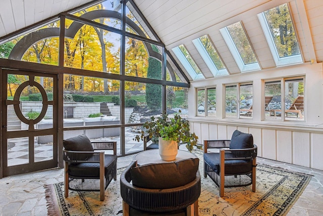 sunroom / solarium featuring lofted ceiling