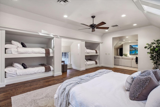 bedroom featuring lofted ceiling, dark wood-type flooring, and ceiling fan