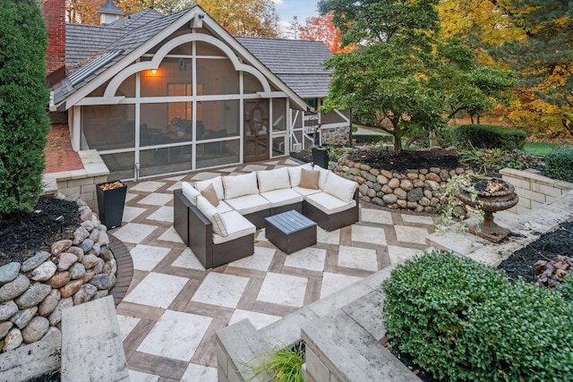 view of patio / terrace with a sunroom and an outdoor living space